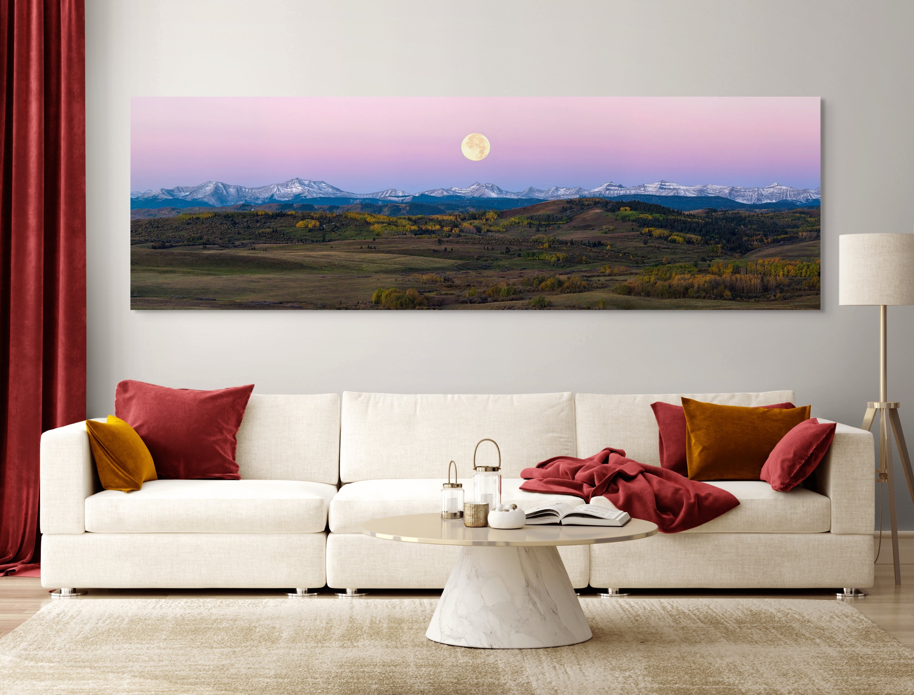 Twilight Over the Rockies fine art print by James Andrew displayed as a large wall art piece in a warm modern living room